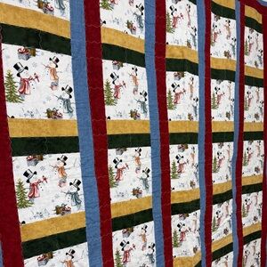 Festive Snowman Quilt with Multicolor Stripes